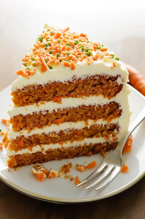 A slice of carrot cake on a plate.