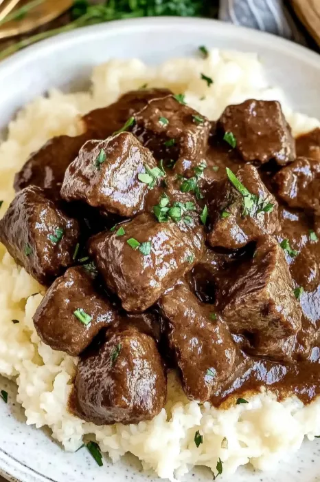 A plate of meat and rice.
