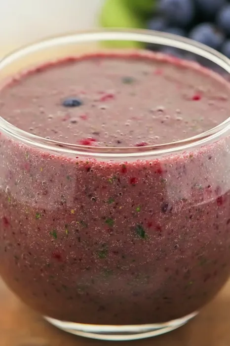 A glass of berry smoothie.