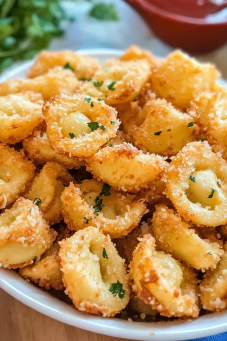 Bowl with crispy pasta and herbs.