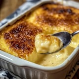 A spoon is in a bowl of food.