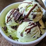A bowl of ice cream with chocolate and chocolate chips.